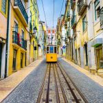 Португалия, Lisbon, Portugal old town streets and tram.